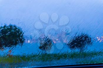 A view from behind a rain-covered windsield of the Seattle skyline