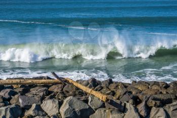 Waves roll onto the rock breakwater in Westport, Washington.