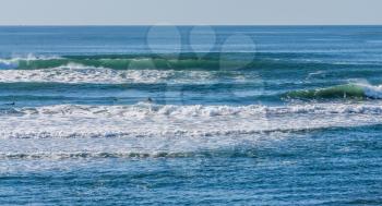 Waves suitable for surfing roll in at Westport, Washington.