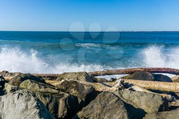 Waves roll onto the rock breakwater in Westport, Washington.