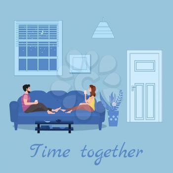 Cute loving couple on cozy sofa, drinking tea or drinks and eating together at home