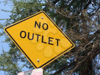 No outlet sign with green tree looking up