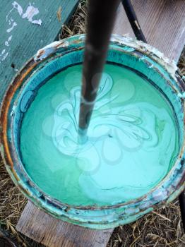 Aqua blue green turquoise paint mixed in bucket home repair improvement