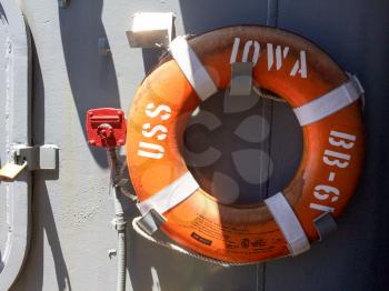 Round orange life ring preserver on USS Iowa naval warship destroyer battleship