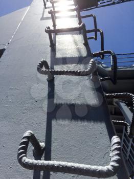 Steel metal ladder climbing up concept on USS Iowa naval warship destroyer battleship