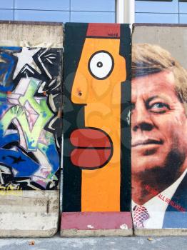 Urban street art on Berlin Wall section in california street