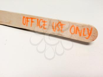 Wooden tongue depressor office use only text on white background