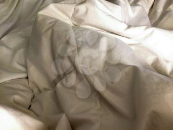 White fluffy sheets and comforter set on bed