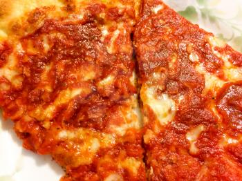 delicious red pizza slices close up on plate yummy to eat