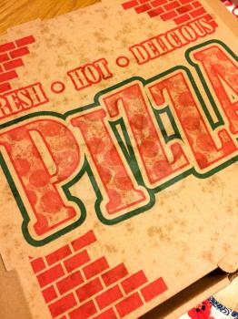 Classic pizza box cardboard with red letters fresh hot delicious