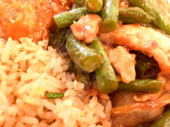 Chinese takeout food orange chicken green beans fried rice close up