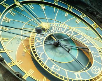 Close up detail of bohemian astronomical clock with sun and moon zodiac signs and animated figures in old town in Prague, Czech Republic.