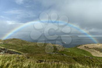 Landscape of Faroe Islands showing rainbow