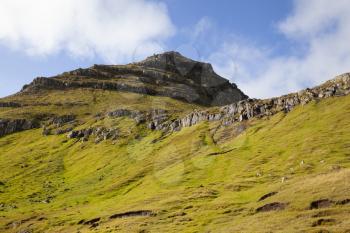 Green grass pyramid mountain of Bordoy, Faroe Islands