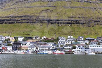 Klaksvik, Faroe Islands - August 2019: Boats in a Port in Klaksvik, the second largest town of the Faroe Islands, autonomous region of the Kingdom of Denmark