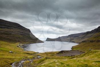 Dramatic landscape of Faroe islands showing on of the fiords