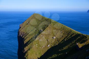 Kallur lighthouse hiking area on a bright sunny day with blue sky