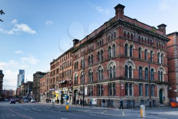 Manchester, UK - 20 October 2019: Corner of Portland St and Charlotte St showing typical red brick buildings