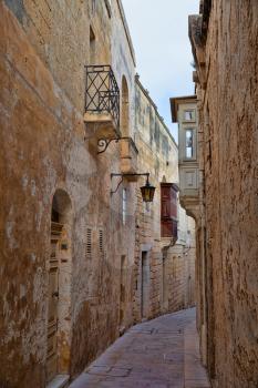 Narrow medieval street in ancient city of Mdina, Malta