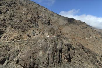Hiking route to Toubkal Mountain from Imlil on a sunny day with the blue sky passing via improvised camp