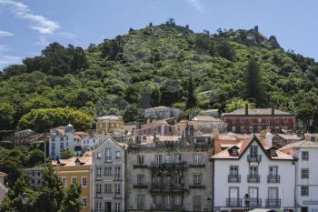 Sintra with Castelo dos mouros (Castle of the Moors) on the top on a sunny day.