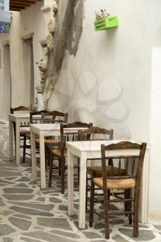 chairs and table at the terrace in Greece