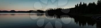 Beautiful panorama of a sunset on a lake in Saguenay, Canada