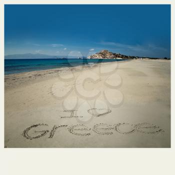 I love greece sign write in sand at Orkos beach in Naxos, Greece