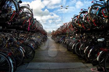 Busy bicycles parking in Amsterdam during a beautiful day