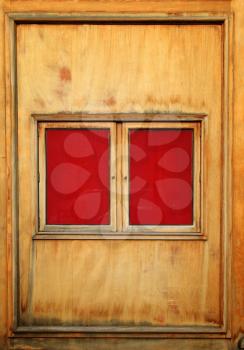 Red and vintage billboard on a wooden wall