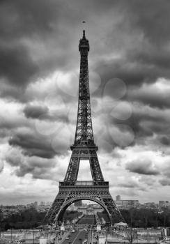 Eiffel tower in a cloudy sky in black and white