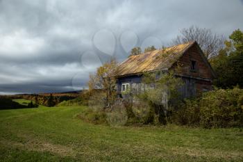 Little barn in a meadow during autumn season
