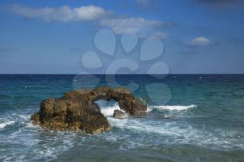 Beautiful rock with an hole at Naxos, Greece near Grotta beach