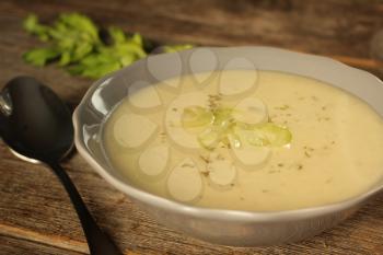 Celery soup on a rustic background