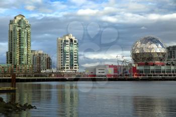 Beautiful view of Vancouver, Canada with apartment towers, the marina, and the science museum