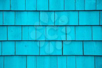 Grunge blue turquoise tiles wall of an old house