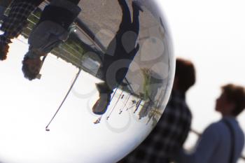 Royalty Free Photo of Peoples Reflection in a Glass Dome