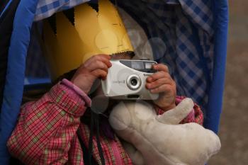 Royalty Free Photo of a Little Boy Holding a Camera