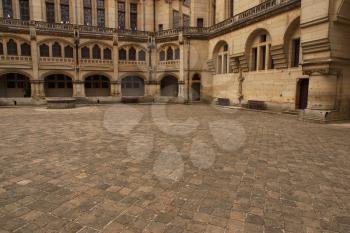 Royalty Free Clipart Image of a Courtyard in France