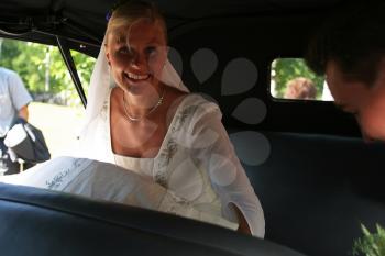 Royalty Free Photo of a Bride in a Car