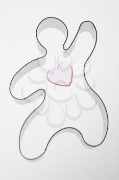 Opaque heart in a gingerbread cookie cutter.