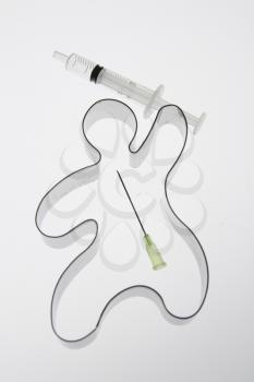 A cookie cutter with a needle syringe.