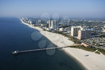 Royalty Free Photo of an Aerial View of Waterfront Buildings and Pier Over the Ocean at Pompano Beach, Florida