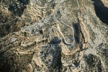 Royalty Free Photo of an Aerial of a Curvy Road in High Desert Landscape of Utah, USA