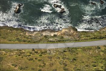Royalty Free Photo of an Aerial of a Coastal Highway Along Pacific Ocean on California West Coast, USA