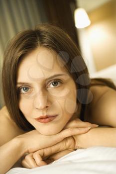 Royalty Free Photo of a Woman Resting Her Head on Her Hands