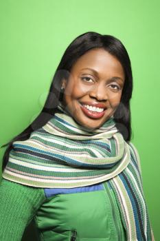 Royalty Free Photo of a Woman Wearing a Scarf Smiling