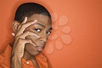 Royalty Free Photo of Young Man With Hand on His Face