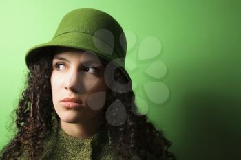 Royalty Free Photo of a Young Woman on Wearing Green clothing and Hat