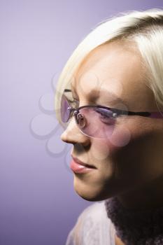Royalty Free Photo of a Woman Wearing Purple Sunglasses